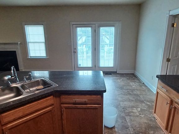 view of dining area and doors to back deck from kitchen