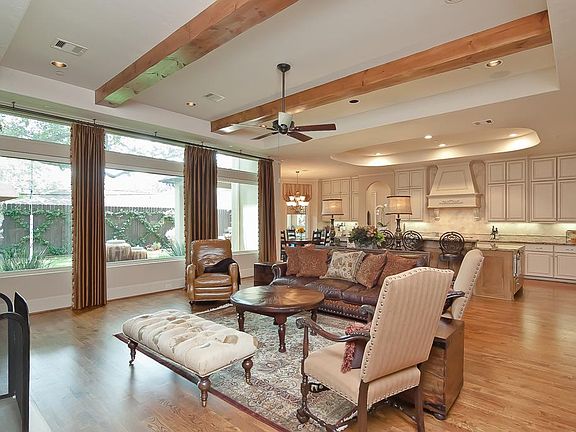 Welcome to this spacious and open great room and kitchen area! Gorgeous beamed ceiling. and wall of 