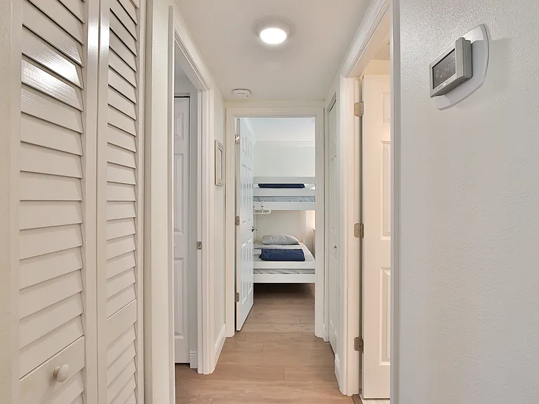 Hallway to bedrooms and guest bathroom.