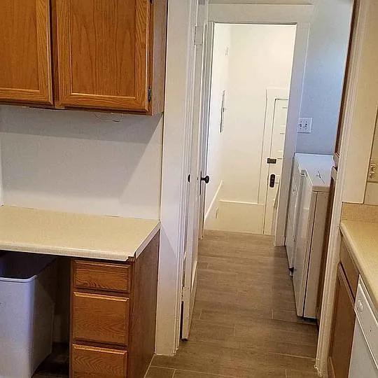 Back hall from kitchen to laundry to back landing & back door to patio.