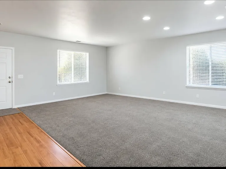 Spacious front living room located just off the main entrance.