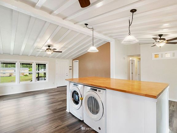 This large island houses the washer and dryer.