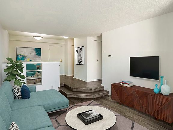 Renovated Package I dining and living areas with hard surface flooring