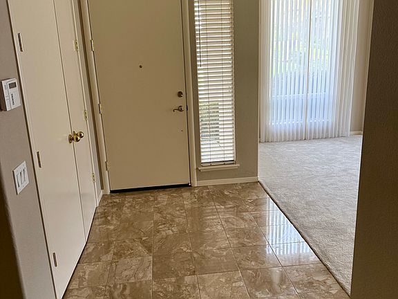 Marble entry with large closet.