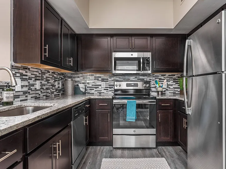Upgraded Kitchen with Hardwood Floors and Designer Backsplash