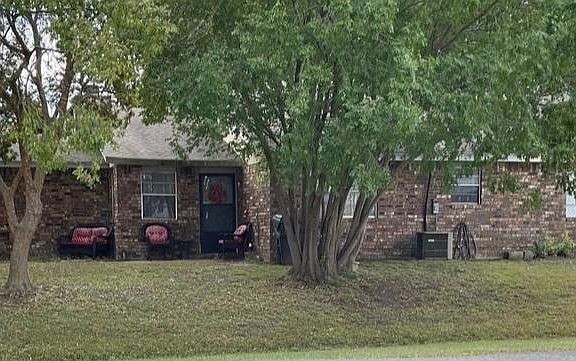 Exterior side view, house sits on a corner lot