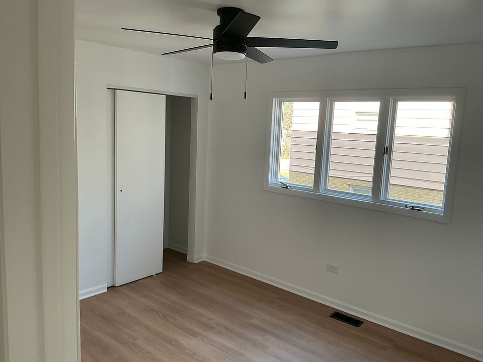 Second bedroom with a single closet. Black matted ceiling fan with LED lighting. Room dimensions 12 x 10.
