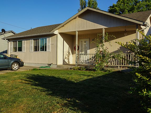 Front with covered porch.