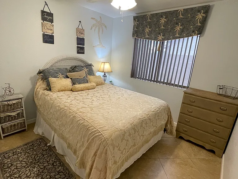 1 of 3 bedrooms...Master features a KING and others have Queens and all have ceiling fas plus tile throughout the entire home for easy cleaning!