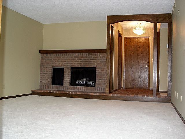 Gas fireplace, elegant light fixtures, designer colors.