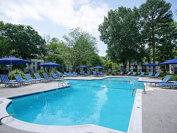 Sunny poolside retreat with lounge chairs
