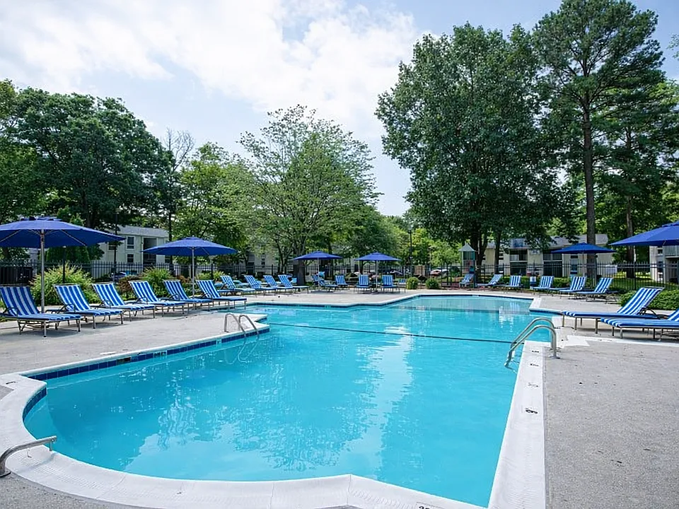 Sunny poolside retreat with lounge chairs