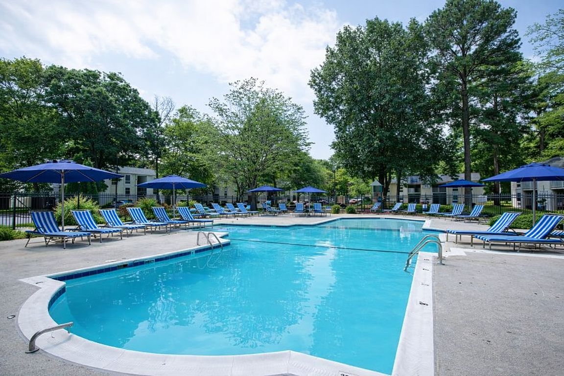 Sunny poolside retreat with lounge chairs