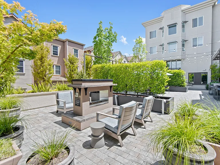 Outdoor Patio with Fire Pit and Seating at Aventine Apartments in Hercules, CA 94547