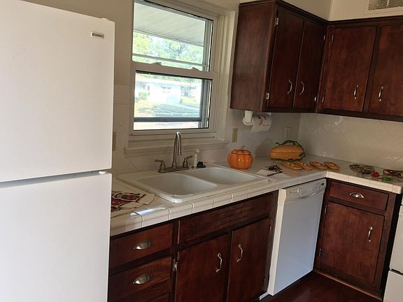 New cabinets, counter top, floor, back splash; includes dish