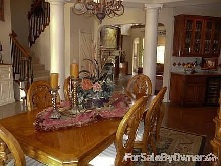 Dining Room
						:
						Many architectural elements, butler's pantry, wine cooler and granite floor.