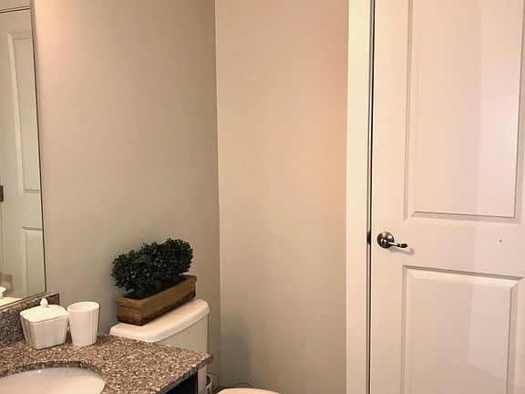 Entry-level half bath with storage closet