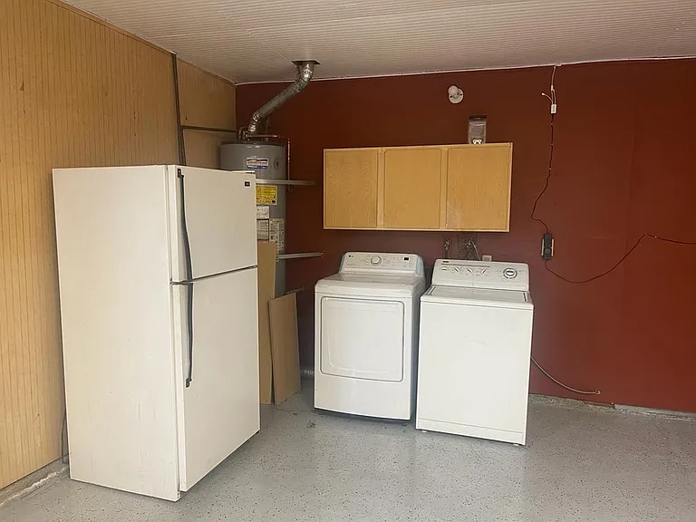 Refrigerator, Washer, and dryer in Garage.