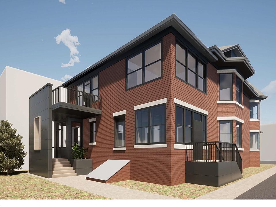 View of building entrance and outdoor deck