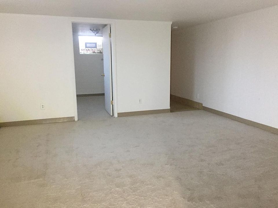 Main living room with entrance to bedroom