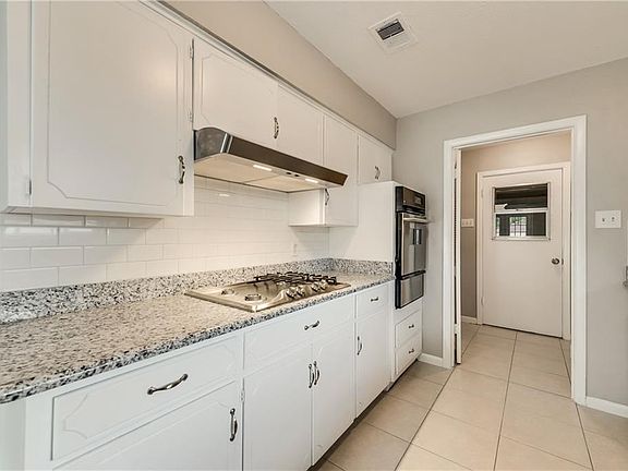 Recently updated kitchen with granite countertops, and Stainless Steel appliances