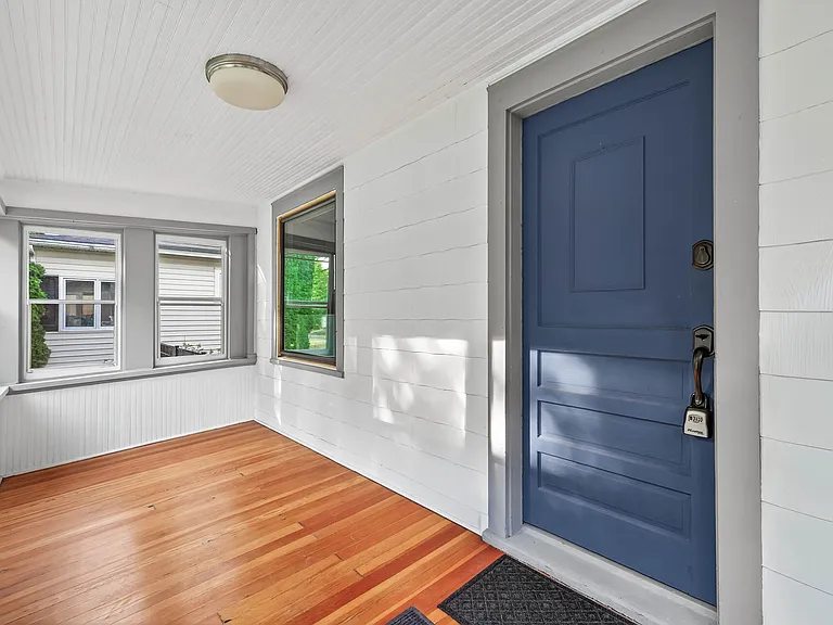 Bright Entryway with beautiful hardwood floors and natural light.