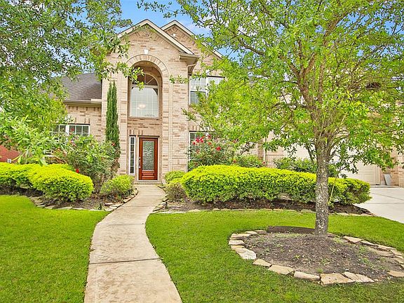 Luscious landscaping and an inviting entrance.