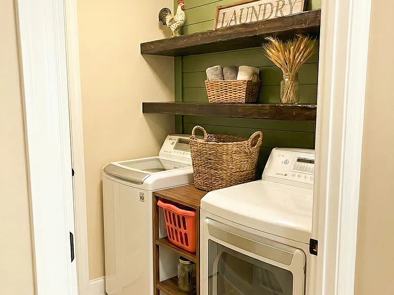 Laundry room off the kitchen, next to the garage door entrance.