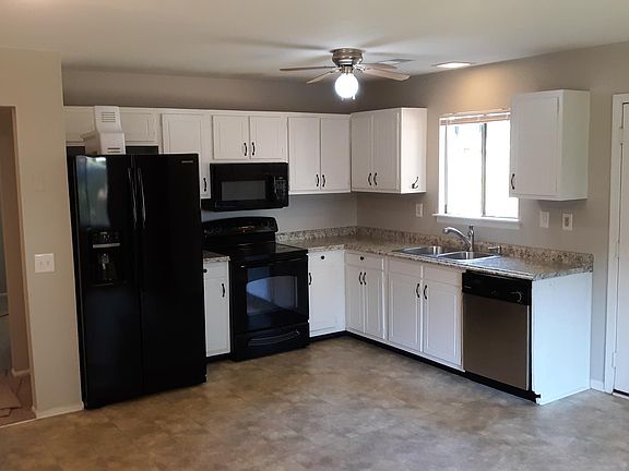 Kitchen with new paint, counter tops, sink, and handles