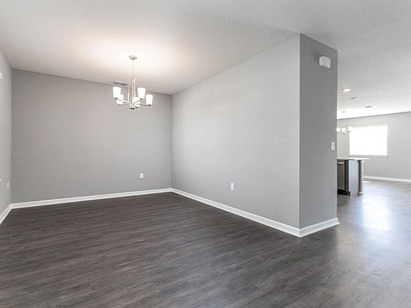 A dining room off the foyer can be used either for dining or as a flexible-use room as suits your ne