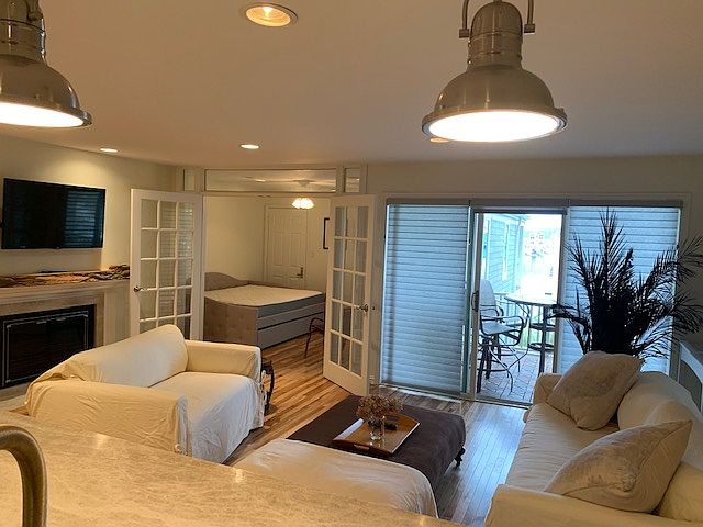 View from kitchen looking into living room, bedroom & balcony.