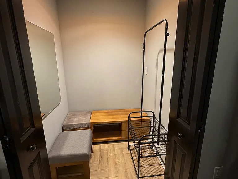 Walk-in closet with mirror