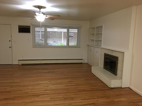 Living room view with fireplace and front door entrance