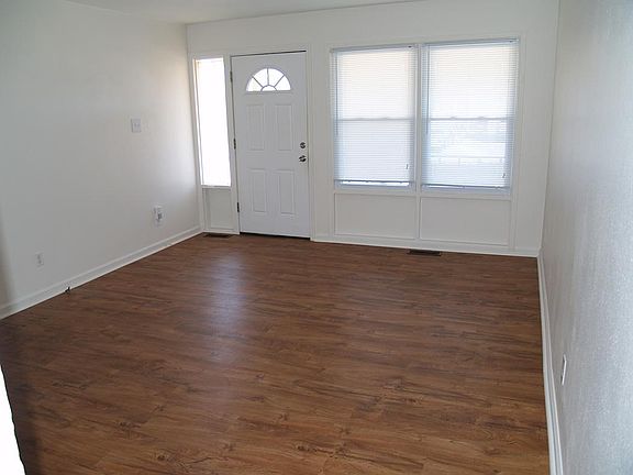 Sunny living room with hardwood look vinyl floors