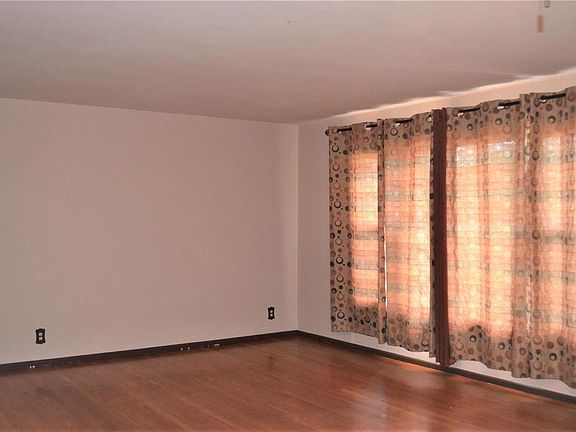 Living Room - Hardwood Floors and Newer Windows throughout the Home!