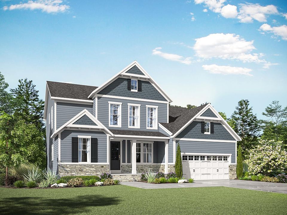 custom home with stone, siding and shakes