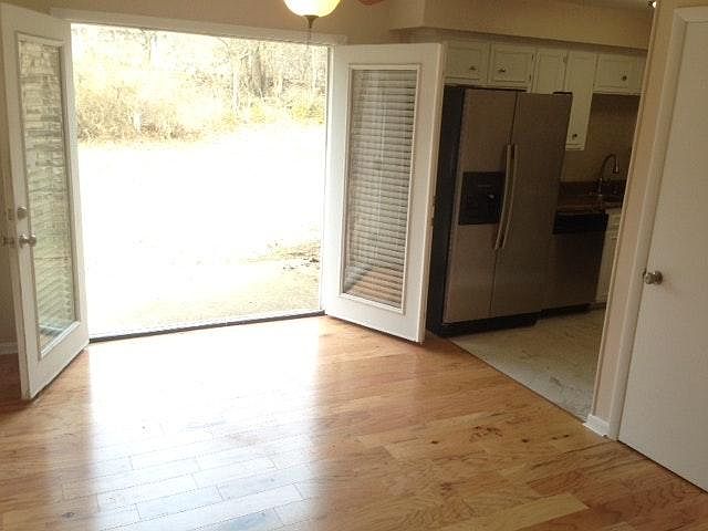 French doors open to outdoor patio.