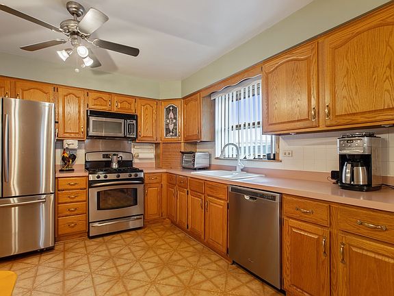 Kitchen has a new refrigerator and dishwasher.