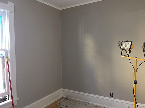 New neutral paint colors in progress throughout! Photo of back bedroom.