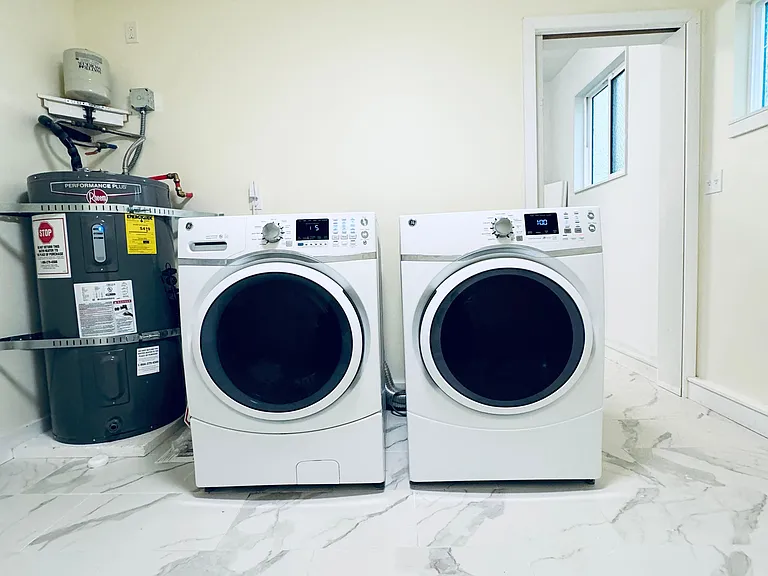 washer and dryer in storage room