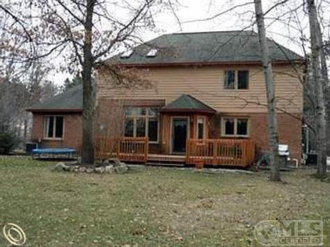 Deck overlooks wooded bkyard.jpg