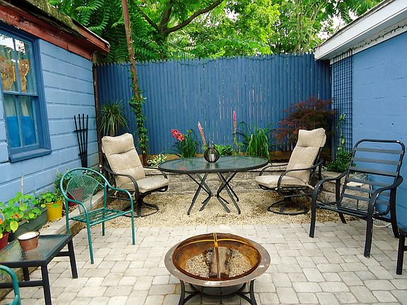 shared patio space includes furniture and grill