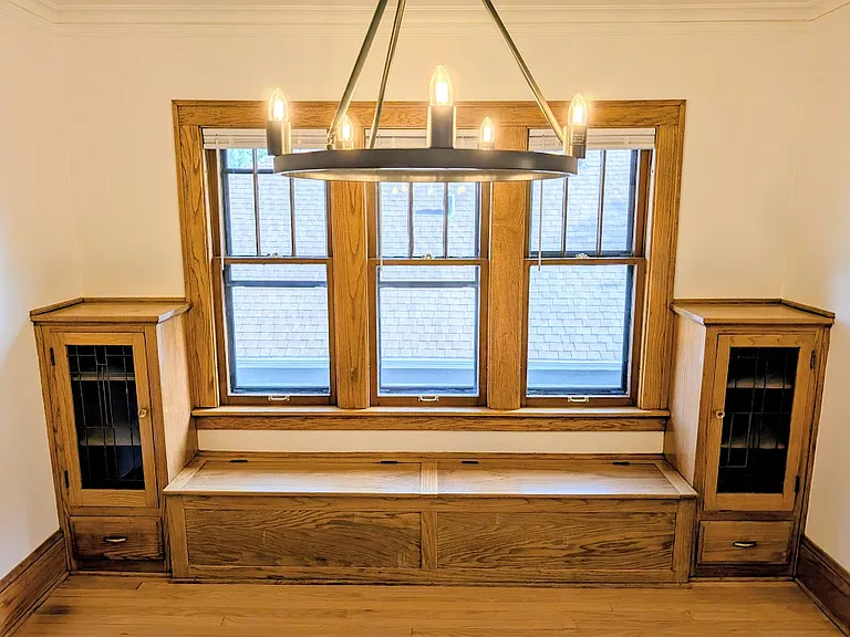[UPPER UNIT]: newly refinished hardwood floors, build-in solid wood cabinetry, ample windows. Dining room