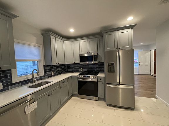 Gorgeous, easy to clean floors. Touch faucet.