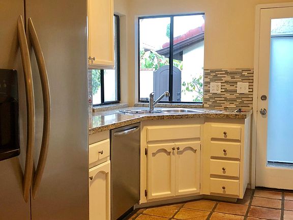 Spanish paver flooring throughout. Stainless steel appliance