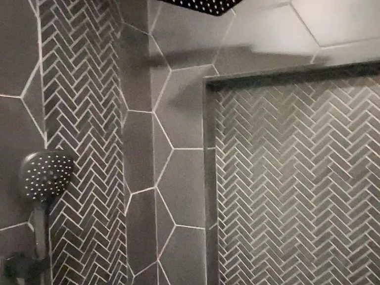 Shower with rain shower head and hand held