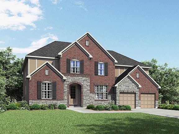 custom two-story home with stucco, stone and brick