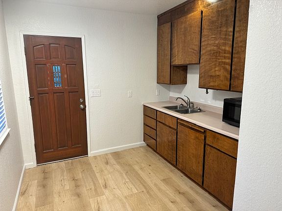 kitchenette with sink and microwave only