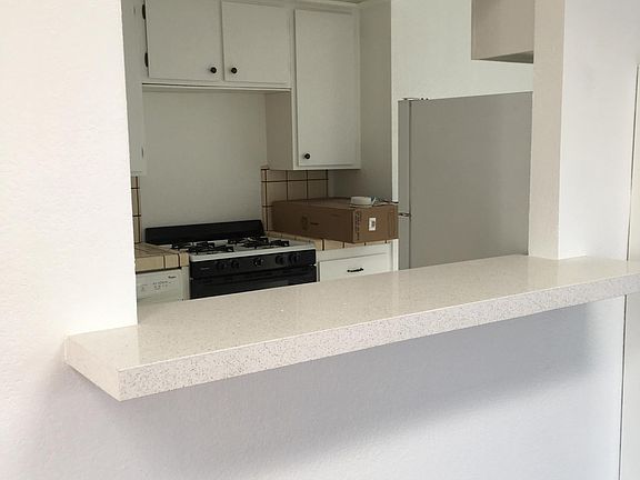 View of kitchen through the pass-through from the living room