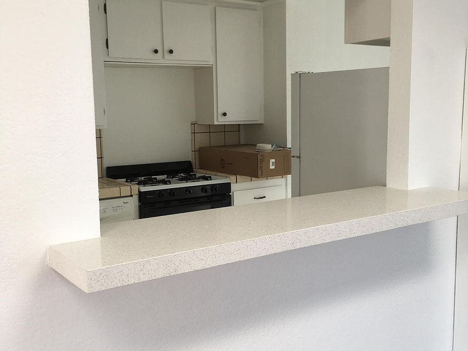 View of kitchen through the pass-through from the living room